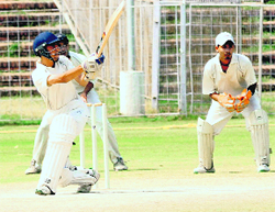 A batsman hits a shot during a T20 tournament at the Sector 16 stadium in Chandigarh on Monday.