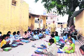 FUTURE OF INDIA: Students study in the open at Government Primary School No 5 at Jwalapur in Haridwar on Monday
