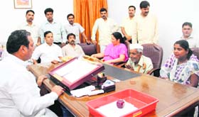 Dehradun Mayor Vinod Chamoli meets people on the first day of office after his re-election in Dehradun on Monday
