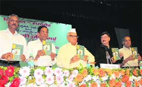 The Uttarakhand Governor, Dr Aziz Qureshi, releases the book written by Satish Shukla (second from left), an IPS officer, at the Raj Bhavan in Dehradun on Monday