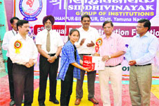 A student of Siddhivinayak College being awarded during the annual day function 