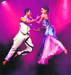 Artistses perform aerial manoeuvers during a function in Gurgaon. 
