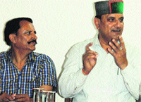 Jagdish Sipahya, Chairman, Kangra Central Cooperative Bank, addresses a press conference, along with Anil Verma, Director of the bank, in Hamirpur on Monday.