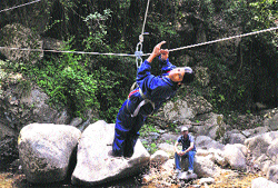 A visually disabled girl performs river-crossing activity in the Dalhousie hills.