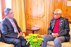 Governor NN Vohra in conversation with J&K Bank chairman Mushtaq Ahmad at Raj Bhawan on Monday. 