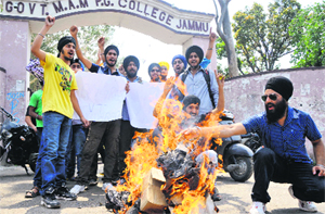 Members of the NPSU protest against Congress leader Sajjan Kumar and UPA Government in Jammu on Monday. 