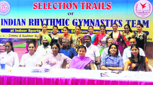 Selected gymnasts along with officials the J&K Gymnastics Association at MA Stadium in Jammu on Monday.