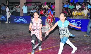 Shuttlers in action during the ongoing inter-school tournament at MA Stadium in Jammu on Monday. 