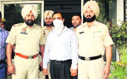 The accused, Amit, in police custody in Ludhiana. 