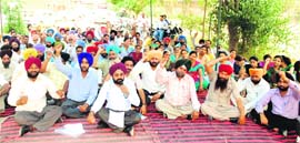 Teachers hold a protest against the policies of the state government in Ludhiana on Monday. 