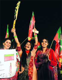 PTI supporters at an election rally in Lahore on Sunday.