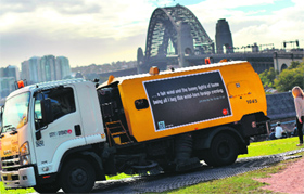 A cleansing truck decorated with giant verse by a poet John Berryman in Sydney on Monday. The citys cleansing trucks have been transformed into literary treasures to celebrate the Sydney Writers Festival.