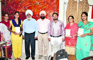 Principal of DAV College Dr JS Anand (third from left) with the students who were presented the award on Tuesday.