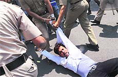 A BJP activist being roughed up by the police duirng a protest near the CBI office in Sector 30, Chandigarh, on Tuesday