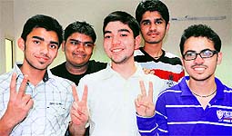 Shubham Chandel, Atesh Bansal, Dhaval Kapil, Loveneet Saini and Amandeep Arora, who performed well in the JEE Mains, at a private coaching centre in Sector 44, Chandigarh, on Tuesday