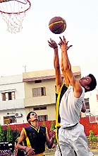 Players in action in a match in the 2nd All-India Asian Challenge Basketball Tournament played at The Asian Schol in Dehradun on Tuesday
