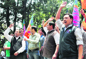Activists of the state BJYM stage a protest against rampant corruption in the UPA government in Shimla on Tuesday. 
