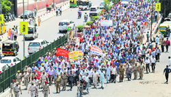 Punbus workers hold a protest march from Chhatar Singh Park to Bharat Nagar Chowk in Ludhiana on Tuesday. Photo: Inderjeet Verma