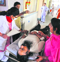The victim, Paramjit Singh, under treatment at the Civil Hospital in Ludhiana. Tribune photo: Himanshu Mahajan