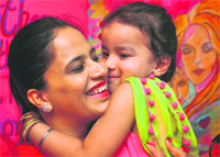 A mother embraces her child during a Mothers Day function at ABC Montessori, BRS Nagar, Ludhiana. TRIBUNE PHOTO: HIMANSHU MAHAJAN 
