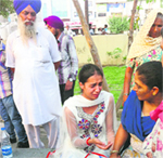 Relatives console Poonam, the only survivor of the Sirhind Canal accident. A tribune photograph