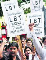 Traders shout slogans during a protest against the proposed local body tax in Mumbai on Tuesday.