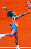 Serena Williams of the U.S. returns a shot to Lourdes Dominguez Lino of Spain during their women's singles match at the Madrid Open.  Reuters