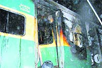 A burnt coach of the Garib Rath train at Talwandi Dogra village in Amritsar