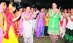 Inmates of girls hostel of Guru Nanak Dev University celebrate at a cultural evening in Amritsar on Wednesday