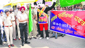 IG Nirmal Singh Dhillon along with SSP Ravcharan Singh Brar flags off the road safety awareness rally in Bathinda on Wednesday. 