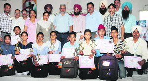 The students of classes IX and X, selected to display their projects and models at the state-level Inspire awards exhibition, being felicitated on the concluding day of the district-level exhibition in Bathinda on Wednesday. 