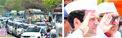 Congress vice-president Rahul Gandhi and Haryana Chief Minister Bhupinder Singh Hooda inspect a guard of honour at Panchkula; and (left) long queues of vehicles during Rahul Gandhi's visit on the Chandigarh-Zirakpur road on Wednesday. Tribune photos: Parvesh Chauhan