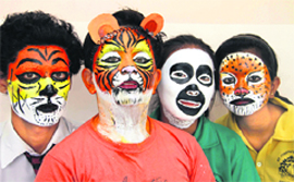 Students participate in a face-painting competition at St Josephs Academy in Dehradun on Wednesday. Tribune photo: Vinod Pundir 