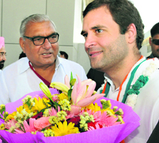Chief Minister Bhupinder Singh Hooda welcomes Congress vice-president Rahul Gandhi at Chandigarh airport on Wednesday. 
