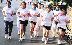 Participants in a cross country race on the occasion of International Red Cross Day in Dharamsala on Wednesday.