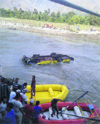Rescue work on at the accident site in Kullu district.