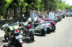 Haphazardly parked vehicles on the main road outside Bahu Plaza commercial complex in Jammu.