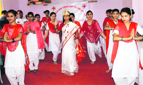 Students perform a dance during a function organised by the Red Cross Society at Alexander Memorial School in Jammu on Wednesday.