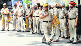 Policemen deployed outside the cremation ground.