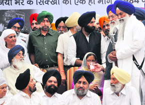 An Akali leader offers juice to riot victim Nirpreet Kaur at Jantar Mantar in New Delhi on Wednesday.