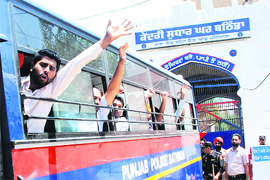 Special trainer teachers raise slogans against the state government while being shifted from the Bathinda Central Jail to a jail in Nabha on Thursday. 