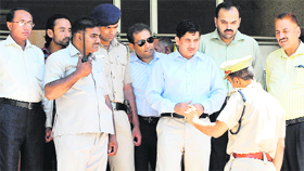 Pakistani and UT police officials come out of the PGI Directors office.