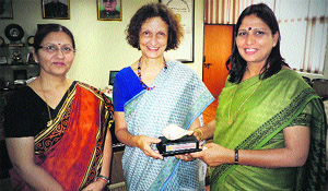 The Vice-Chancellor, Dr Pankaj Mittal (right), presents a memento to Dr Jane E Schekoske during a teachers' orientation programme at Academic Staff College of BPS Women's University, Khanpur Kalan. 