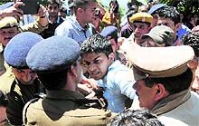 Activists of the ABVP clash with cops as they try to burn an effigy of the Vice-Chancellor on the HPU campus in Shimla on Thursday