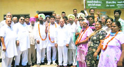 SAD members who have deserted their party to join the Congress ahead of the zila parishad and block samiti election in Kartarpur on Thursday. A tribune photograph 