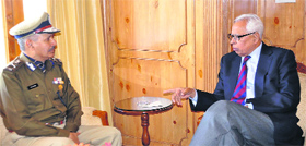 Governor NN Vohra interacts with Special Director General, CRPF, DK Pathak during a meeting in Srinagar on Thursday.