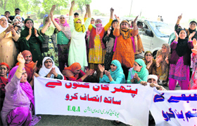 Family members of owners and employees of stone quarries protest against giving royalty to an outside company, in Srinagar on Thursday.