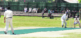 Players in action during the T-20 cricket match in Ganderbal on Thursday.