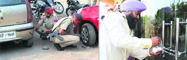 Policemen deflate tyres of vehicles parked in the service lane on Ferozepur Road in Ludhiana on Thursday; and (right) an MC official seals the premises of Hotel Batra for the violation of parking norms.