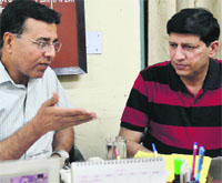 The Civil Surgeon, Dr Subhash Batta (left), with Dr Raj Kumar Karkara during a meeting at the Lord Mahavir Civil Hospital in Ludhiana. 